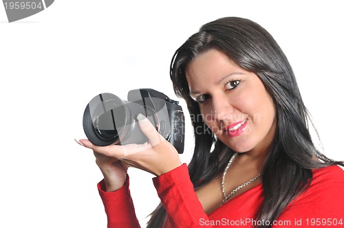 Image of Young woman holding camera in hand taking picture isolated