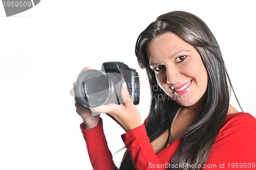 Image of Young woman holding camera in hand taking picture isolated