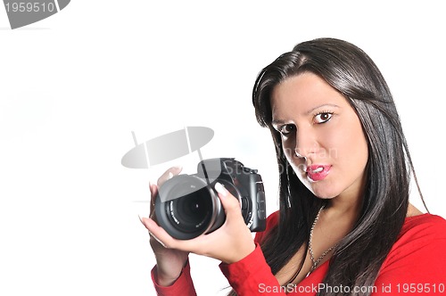 Image of Young woman holding camera in hand taking picture isolated