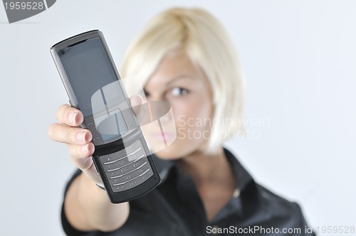 Image of portrait of young blonde business woman holding new modern cellp