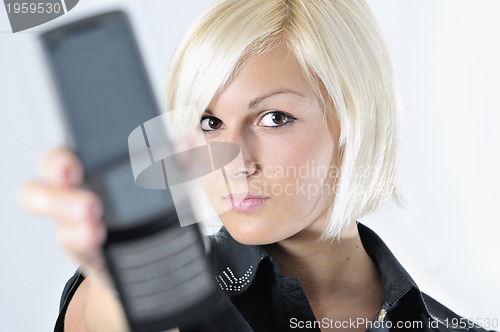 Image of portrait of young blonde business woman holding new modern cellp