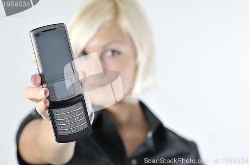 Image of portrait of young blonde business woman holding new modern cellp