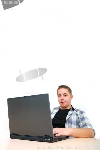 Image of young man working on laptop