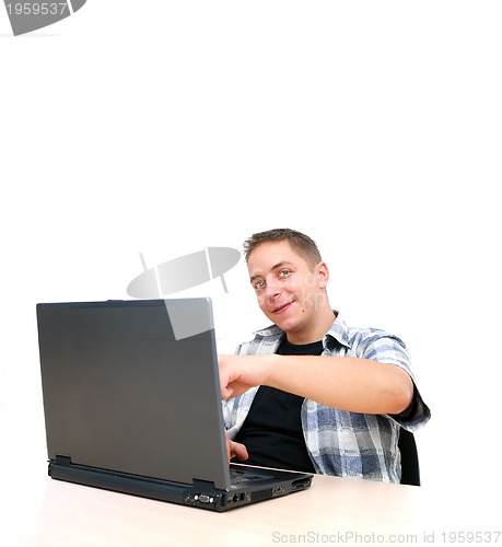 Image of young man working on laptop