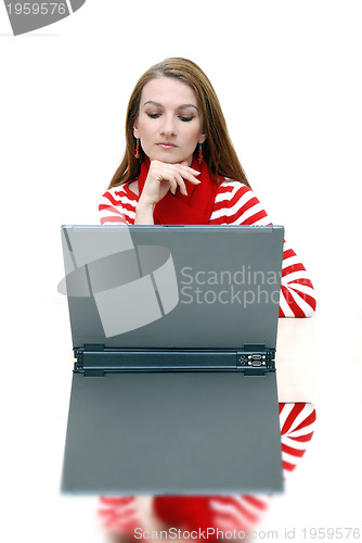 Image of businesswoman  in red with reflection...