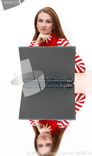 Image of businesswoman  in red with reflection...