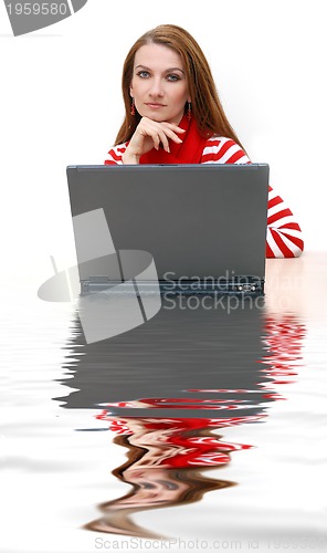 Image of businesswoman  in red with reflection...