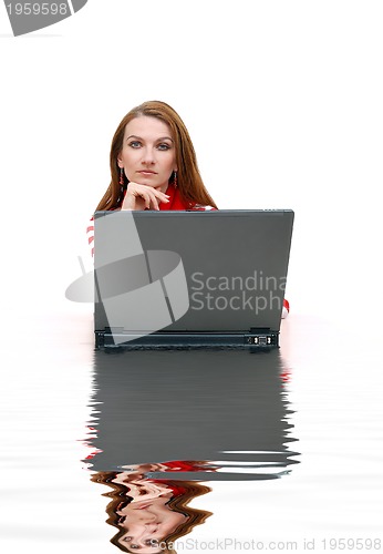 Image of businesswoman  in red with reflection...