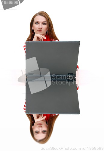 Image of businesswoman  in red with reflection...