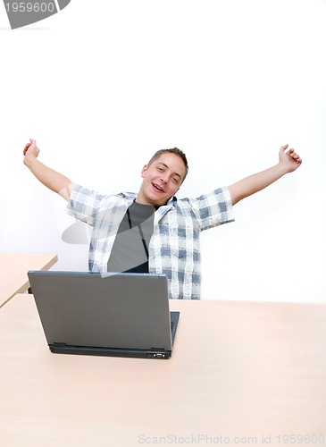 Image of young man working on laptop