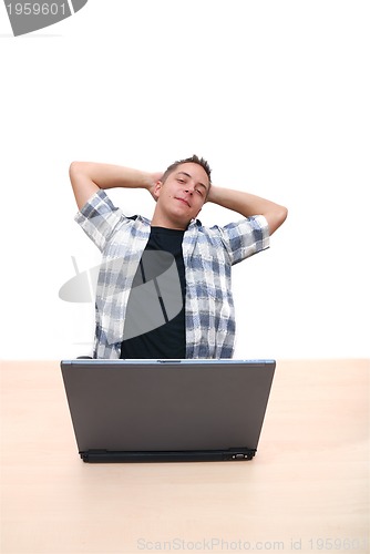 Image of young man working on laptop