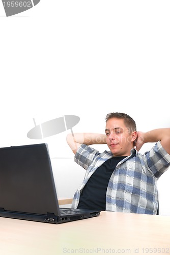 Image of young man working on laptop