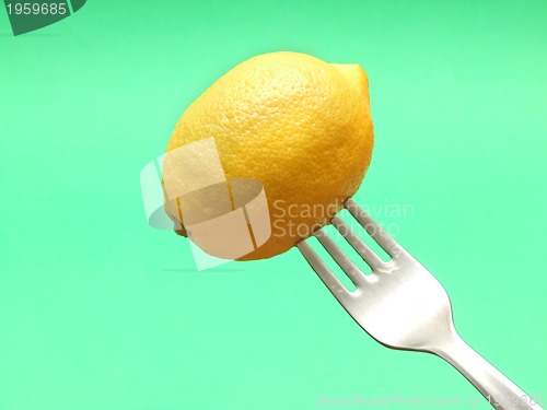 Image of fresh lemon on fork