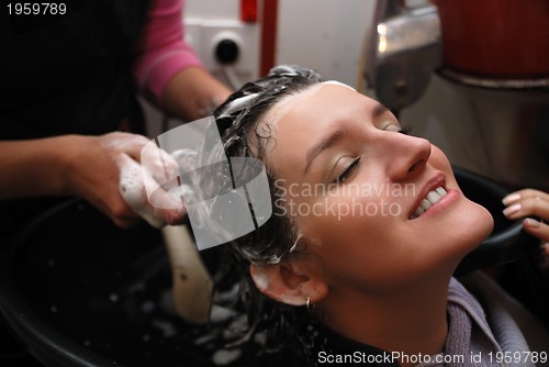 Image of Beautyful young woman enjoying a hair-wash