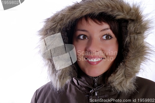 Image of Cute young woman smiling in winter jacket