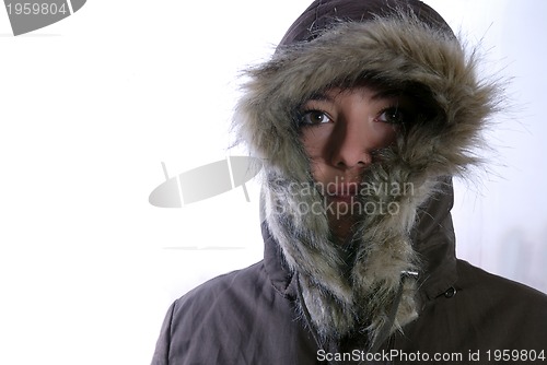 Image of Cute young woman smiling in winter jacket