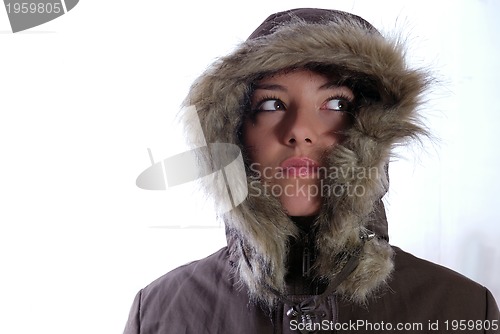 Image of Cute young woman smiling in winter jacket