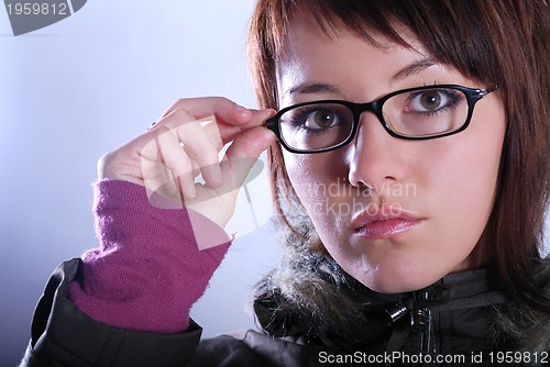 Image of Portrai of a young woman wearing glasses