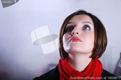 Image of Portrait of a young woman wearing red scarf