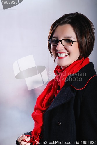 Image of Portrait of a young wonam wearing red scarf