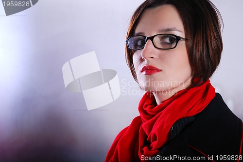 Image of Portrait of a young wonam wearing red scarf