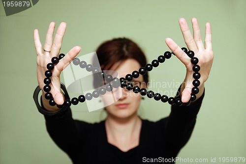 Image of Female with black pearls