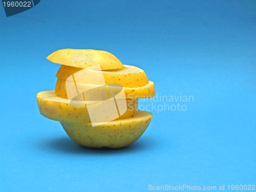 Image of sliced fruit on blue background