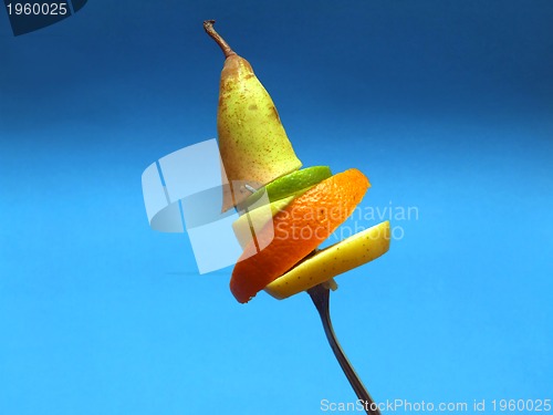 Image of sliced fruits on fork