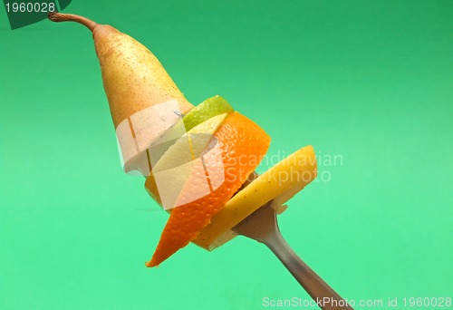 Image of sliced fruits on fork