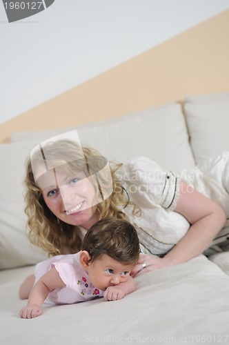 Image of young mother and baby relaxing 