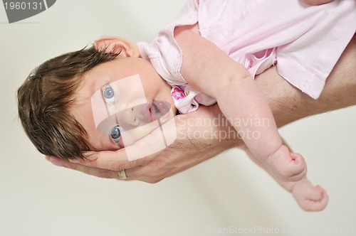 Image of man hold little baby in hand