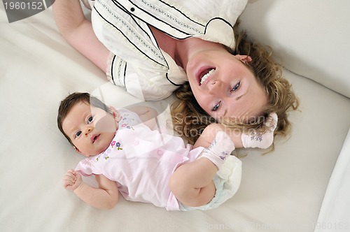 Image of young mother and baby relaxing 