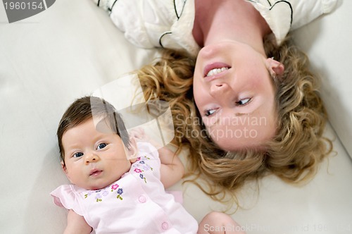 Image of young mother and baby relaxing 