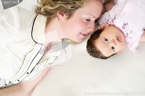 Image of young mother and baby relaxing 