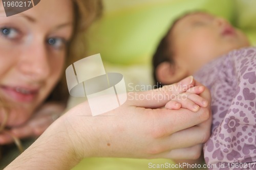 Image of man hold little baby in hand