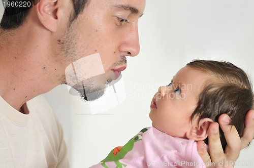 Image of indoor portrait with happy young famil and  cute little babby 