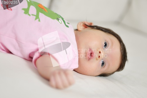 Image of indoor portrait with happy young famil and  cute little babby 