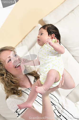 Image of young mother and baby relaxing 