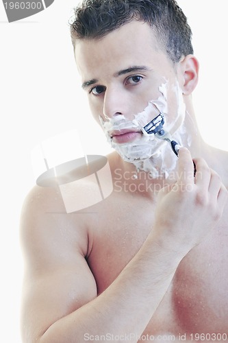 Image of young man shaving