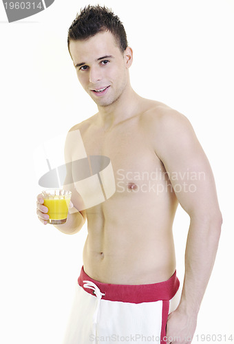 Image of young athlete dringing orange juice