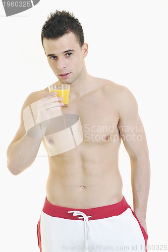 Image of young athlete dringing orange juice