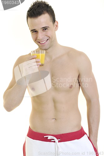 Image of young athlete dringing orange juice