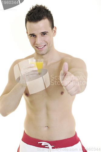 Image of young athlete dringing orange juice