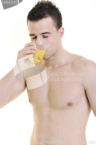 Image of young athlete dringing orange juice