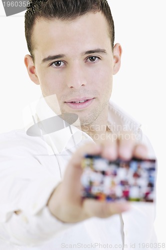 Image of young business man with empty card isolated on white