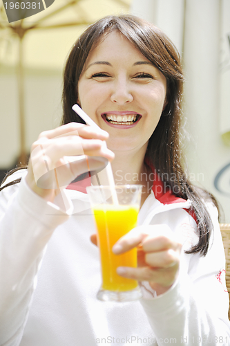 Image of woman drink juice outdoor