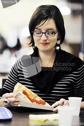 Image of woman eat pizza food at restaurant