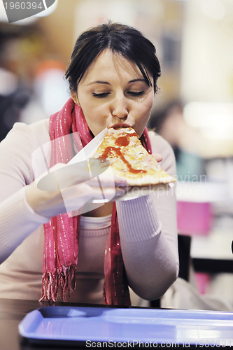 Image of woman eat pizza food at restaurant