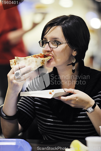 Image of woman eat pizza food at restaurant