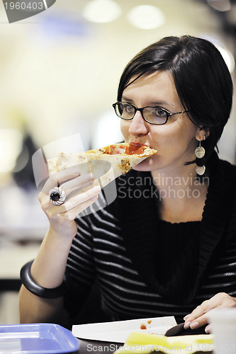 Image of woman eat pizza food at restaurant